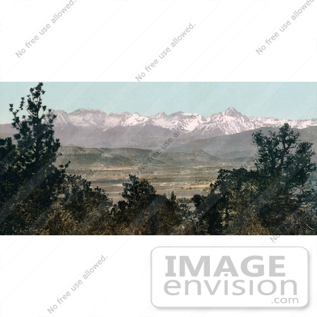 #40816 Stock Photo of Green Trees Framing A Landscape With Snow Covered Mount Sneffels Range In The Rocky Mountains, Colorado by JVPD