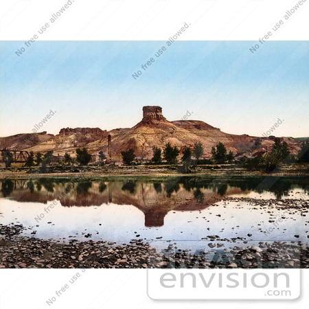 #40832 Stock Photo of a Factory At The Base Of A Butte Reflecting In Green River, Utah by JVPD