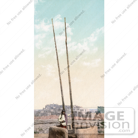 #40912 Stock Photo of a Taos Native American With A Ladder At Taos Pueblo, New Mexico by JVPD