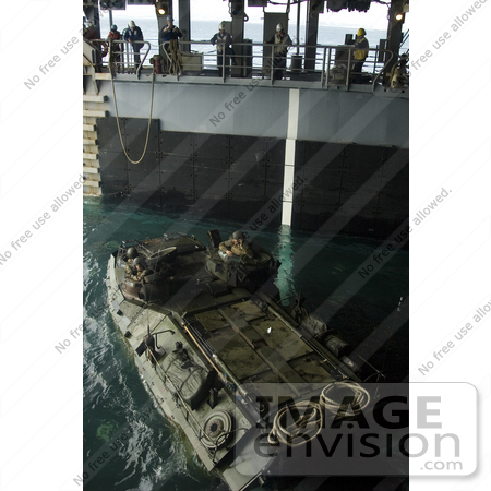 #41369 Stock Photo of United States Marines Rotating Their Amphibious Assault Vehicle In The Well Deck Of An Amphibious Dock Landing Ship by JVPD