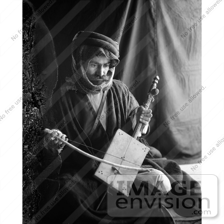 #43225 RF Photo Of A Black And White Bedouin Man Playing A Rababeh Instrument by JVPD