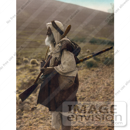 #43463 RF Stock Photo Of An Arab Shepherd Watching Over His Flock With A Rifle by JVPD