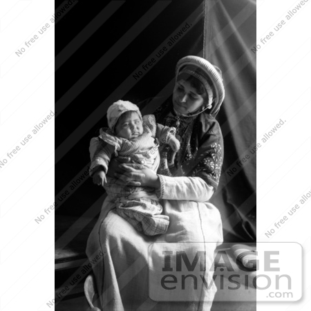 #43466 RF Stock Photo Of A Ramallah Woman Holding Her Baby In Her Lap by JVPD