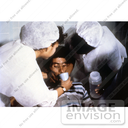 #5153 Photography of a Cholera Patient is Drinking Oral Rehydration Solution (Ors) in order to Counteract his Cholera-Induced Dehydration by JVPD