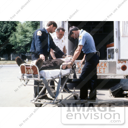 #5174 Pictur of Emergency Medical Technicians (EMT's) Putting a Patient Into an Ambulance by JVPD