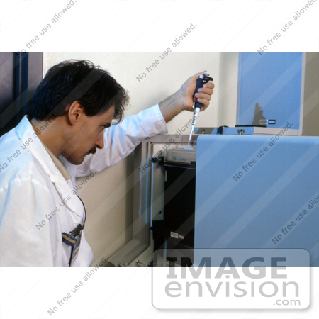 #5314 Picture of a Lab Technician Pipetting Specimens by JVPD