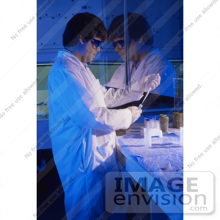#5316 Stock Photography of a Picture of a Laboratory Worker Pipetting Specimens During a Lab Experiment by JVPD