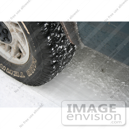 #534 Image of a Tire on a Snowy Road by Jamie Voetsch
