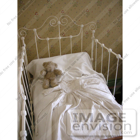 #53713 Royalty-Free Stock Photo of a Teddy Bear In A Baby Crib by Maria Bell