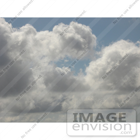 #53723 Royalty-Free Stock Photo of a Puffy Cloudy Sky by Maria Bell