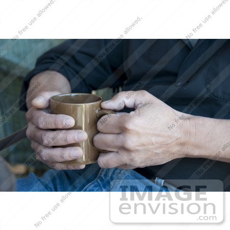#53733 Royalty-Free Stock Photo of a Man Holding A Hot Drink In A Mug by Maria Bell