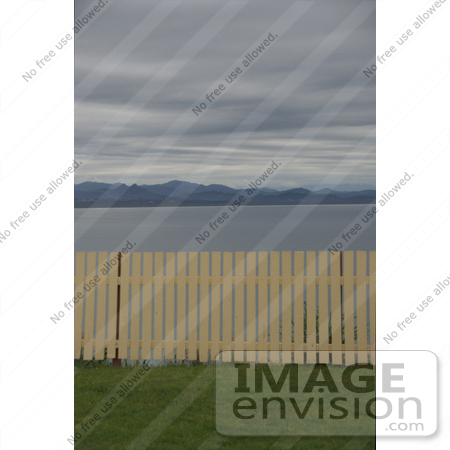 #53769 Royalty-Free Stock Photo of a Fence by a Beach by Maria Bell