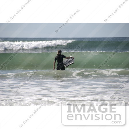 #53770 Royalty-Free Stock Photo of a Surfer In The Waves by Maria Bell