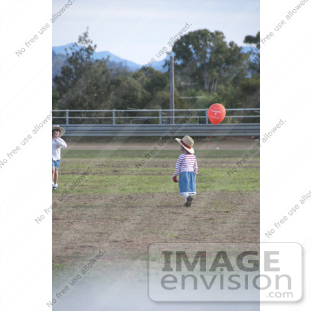 #53816 Royalty-Free Stock Photo of Children in a Field by Maria Bell