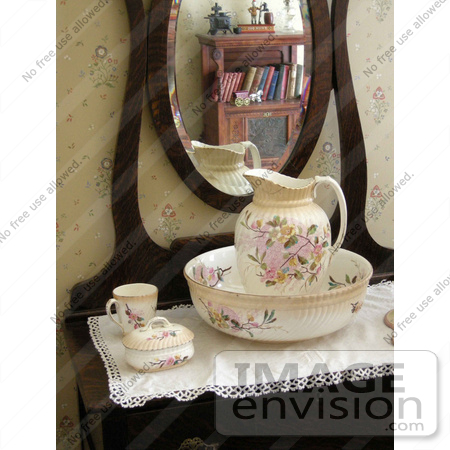 #53818 Royalty-Free Stock Photo of a vintage water pitcher by a mirror by Maria Bell