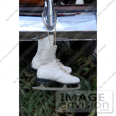 #53824 Royalty-Free Stock Photo of a pair of ice skates hanging from a bumper by Maria Bell