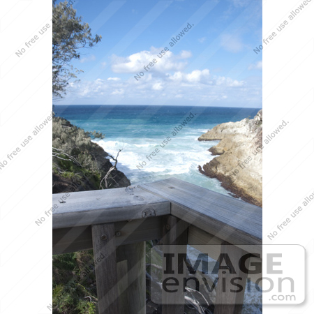 #53837 Royalty-Free Stock Photo of a balcony rail over a beach by Maria Bell