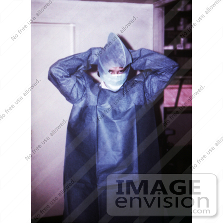 #6299 Picture of a Doctor Putting On Hospital Gown in Johannesburg, South Africa by KAPD