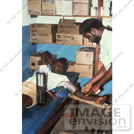 #6304 Picture of a Man Giving Blood at the Segbwema, Sierra Leone Clinic by KAPD