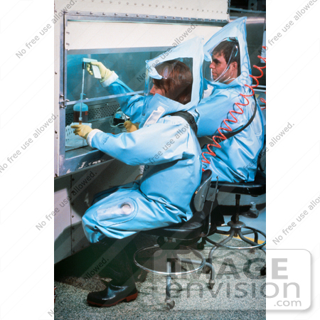 #6306 Picture of a Laboratorians Working Under a Flow Hood Inside a BSL-4 (Bio Safety Lab) Laboratory by KAPD