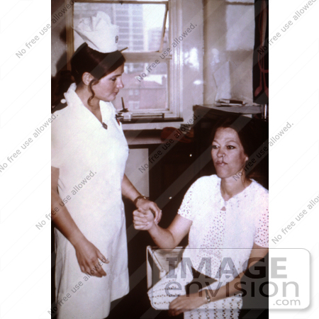 #6310 Picture of a Nurse Checking the Vital Signs of an Isolated Hospital Staff by KAPD