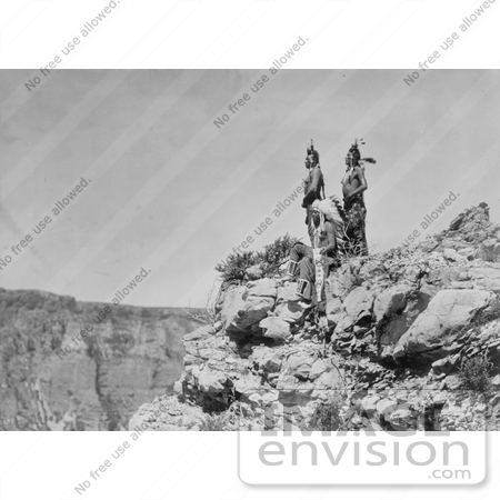 #7099 Stock Photography: 3 Crow Indians on Cliff by JVPD
