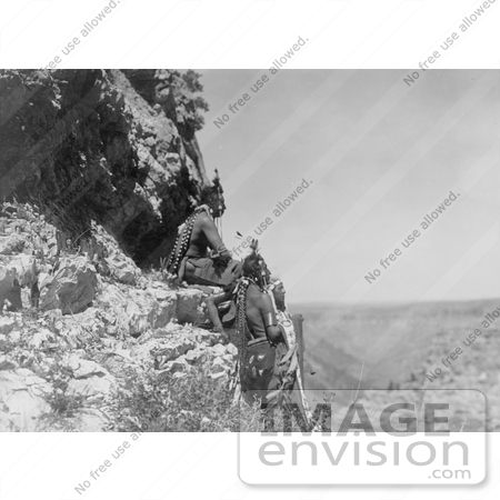 #7111 Stock Photography: Three Crow Indians on Rock Ledge by JVPD