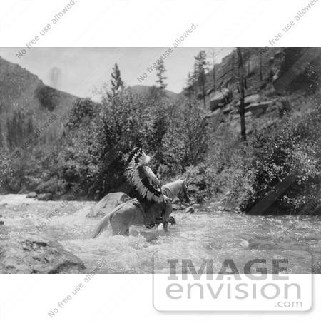 #7121 Stock Photography: Bullchief Crossing River on Horseback by JVPD