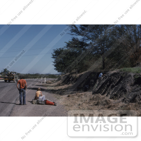 #7325 Picture of a Man and Woman Hitchhiking in Wankie, Rhodesia by KAPD