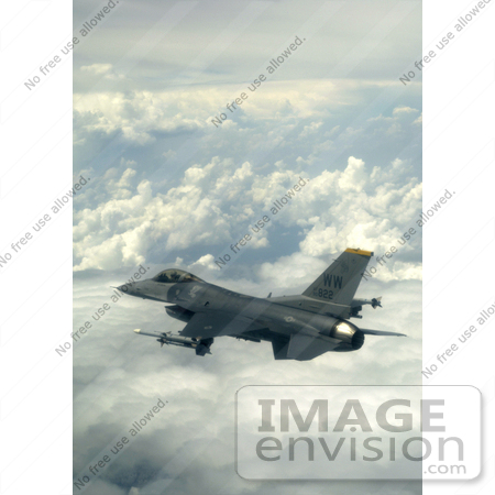 #7365 Stock Image of an F-16 Fighting Falcon Above the Clouds by JVPD