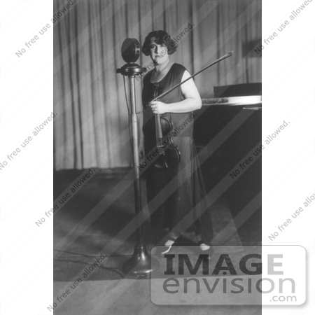 #7377 Stock Photo of Renee Chemet in Front of Microphone, Holding Violin by JVPD