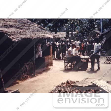 #7472 Picture of a Person Issuing Ration Cards to African People in Port Harcourt, Nigeria During the Nigerian-Biafran War by KAPD