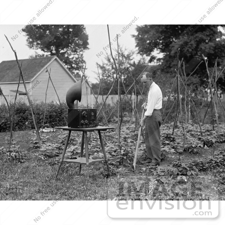 #7690 Stock Photography of a Man Gardening and Listening to a Radio by JVPD