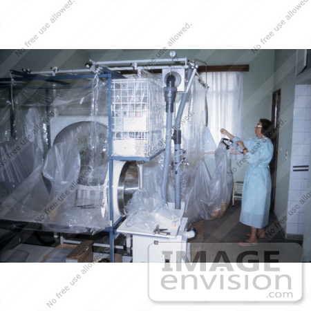 #7728 Picture of South African Virologist Adjusting Plastic Ebola Virus Isolators by KAPD