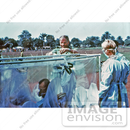 #8376 Picture of Fastening an Isolation Unit with a Suspected Ebola Patient - 1976 by KAPD