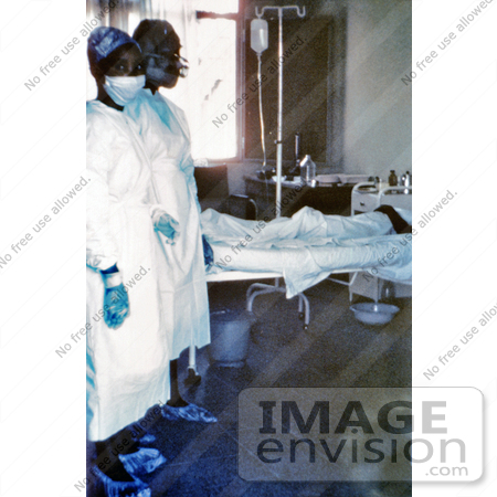 #8380 Picture of Two Nurses Standing In Front of a Patient Who is Infected with the Ebola Virus - 1976 by KAPD