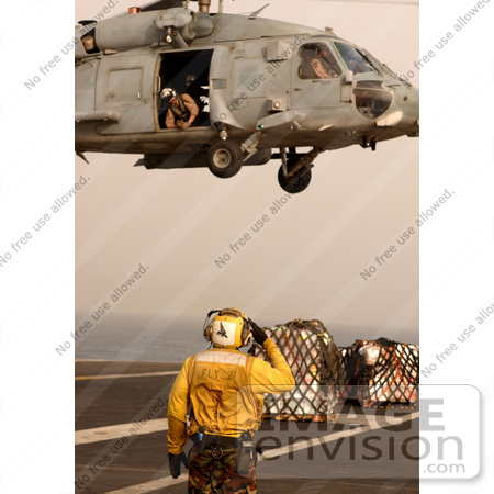#8846 Picture of a Person Directing a Seahawk Helicopter by JVPD