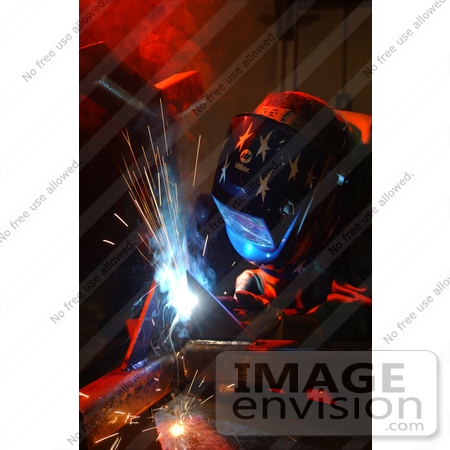 #8945 Picture of a Soldier Welding to Repair a Munitions Stand by JVPD
