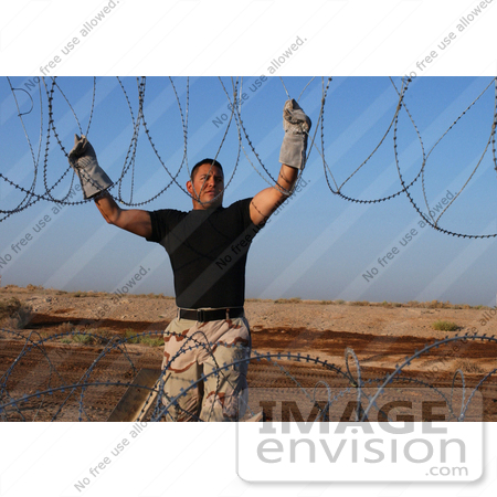 #9030 Picture of Installing Barbed Wire by JVPD