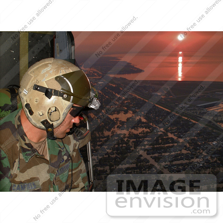 #9064 Picture of a Pararescueman Looking for Survivors After Hurricane Katrina by JVPD