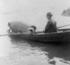 #13739 Picture of Annie Edson Taylor in a Barrel, Being Rowed to a Drop Off Point at Niagara by JVPD