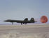 #1394 Photo of an SR-71 Landing With a Red Drag Chute Behind 01/01/1990 by JVPD