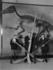 #19611 Photo of Men Holding Punt Guns by a Duck Billed Reptile Dinosaur Skeleton in a Museum, 1920s by JVPD