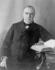 #20317 Historical Stock Photo of the 25th American President, William McKinley, Seated and Resting His Hand on an Open Book by JVPD