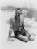 #21235 Stock Photography of Eugene O’Neill, the Playwright, Wearing Swimming Shorts and Sitting in Warm Sand on a Beach by JVPD