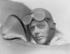 #21639 Stock Photography of Charles Lindbergh in a Helmet and Goggles, Sitting in a Plane Cockpit by JVPD