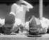 #27893 Historical Stock Photo of Two Boys Bending Over And Shoving Their Faces Into Pies While Competing During A Pie Eating Contest In 1923 by JVPD