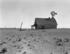 #3091 Stock Photography of an Occupied Dust Bowl Farm House With a Windmill in Dalhart, Texas by JVPD