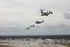 #35242 Stock Photo of a V-22 Osprey, CH-53E Super Stallion Helicopter, CH-46 Sea Knight Helicopter, UH-1N Huey Aircraft, And an AH-1 Cobra Aircraft Performing a Formation Flight by JVPD
