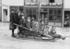 #35664 Stock Photo Of A Group Of Children Posing On A Sled In The Middle Of A Village Street In Seward, Alaska by JVPD